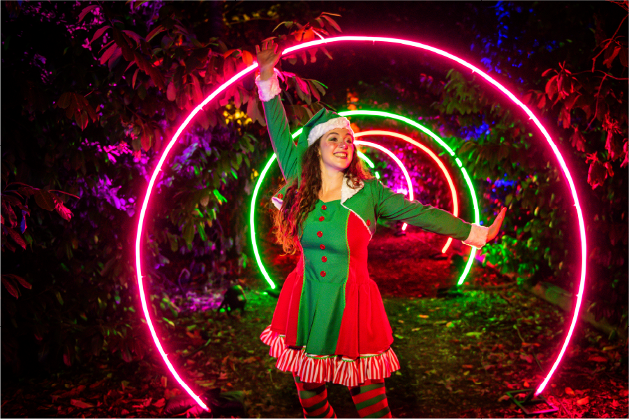 An illuminated character among glowing neon rings